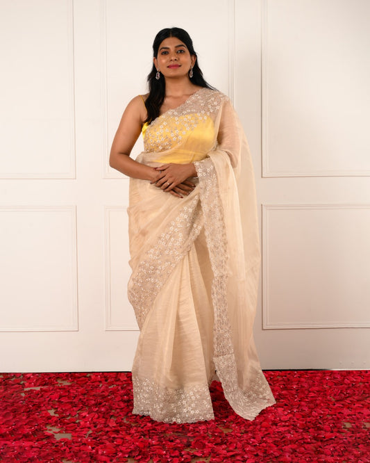 Nuraani – Golden Tissue Saree with Floral Thread Embroidery & Sequin Accents