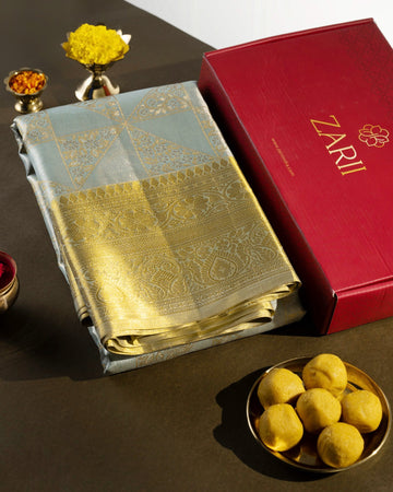 Pastel Blue Pure Tissue Silk Saree with Geometric Floral Motifs and Gold Border