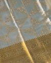 Pastel Blue Pure Tissue Silk Saree with Geometric Floral Motifs and Gold Border