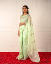 Baag-e-Noor – Green Saree with Deer & Floral Motifs and Handcrafted Kardana Scallop Border
