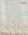 Nuraani – Blue Tissue Saree with Floral Thread Embroidery & Sequin Accents