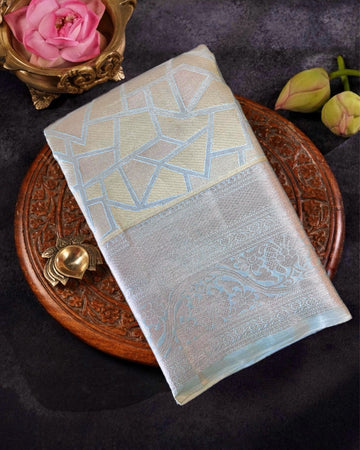 Decorative fabric with geometric pattern on a wooden plate with flowers and a rose.